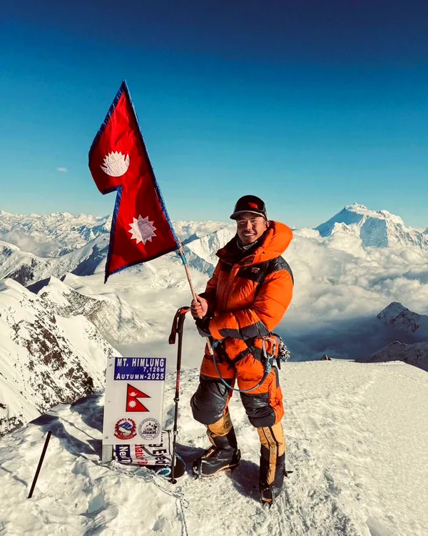 Chatur Tamang on the summit of Mt. Himlung (7,126m) with Nepal flag, Autumn 2025